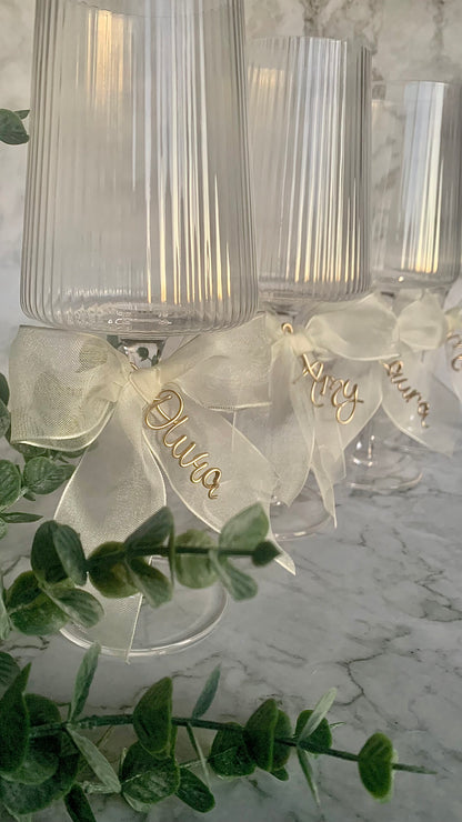 3 bow charms on wine glasses for bridesmaids