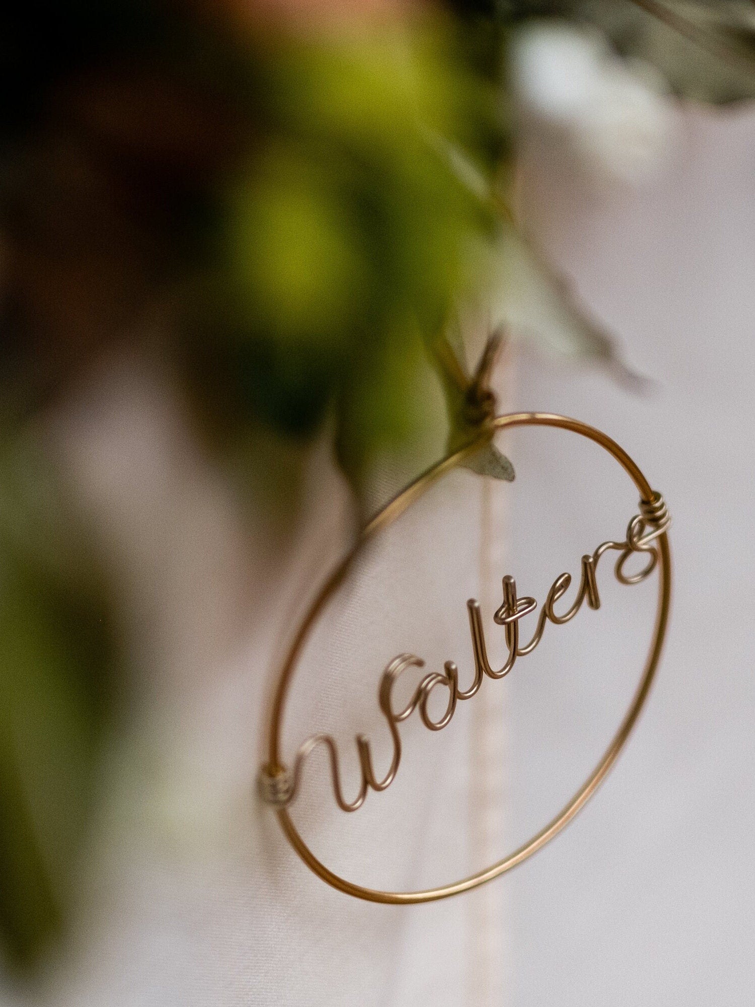 close up shot of wire bauble with personalised name