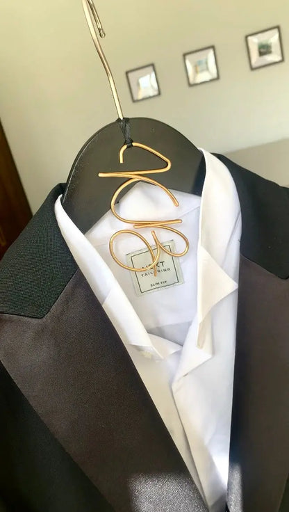 initials wire hanger charm for groom, on black hanger with grooms black tie suit