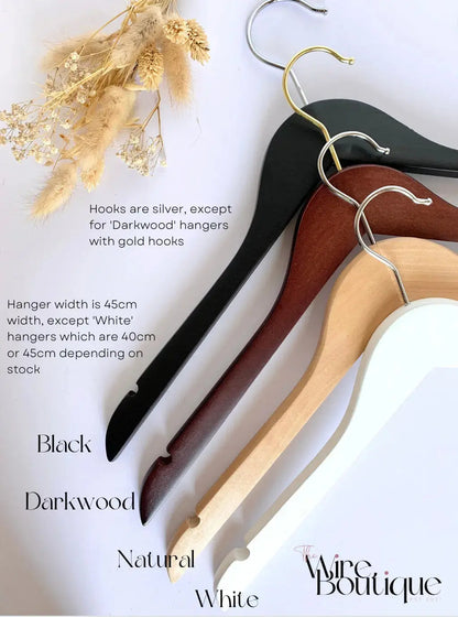 choice of wooden hanger colours - black, dark wood, natural wood, and white