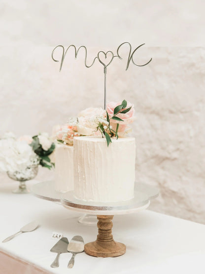 wedding cake topper, made in silver wire, displaying the couple’s initials