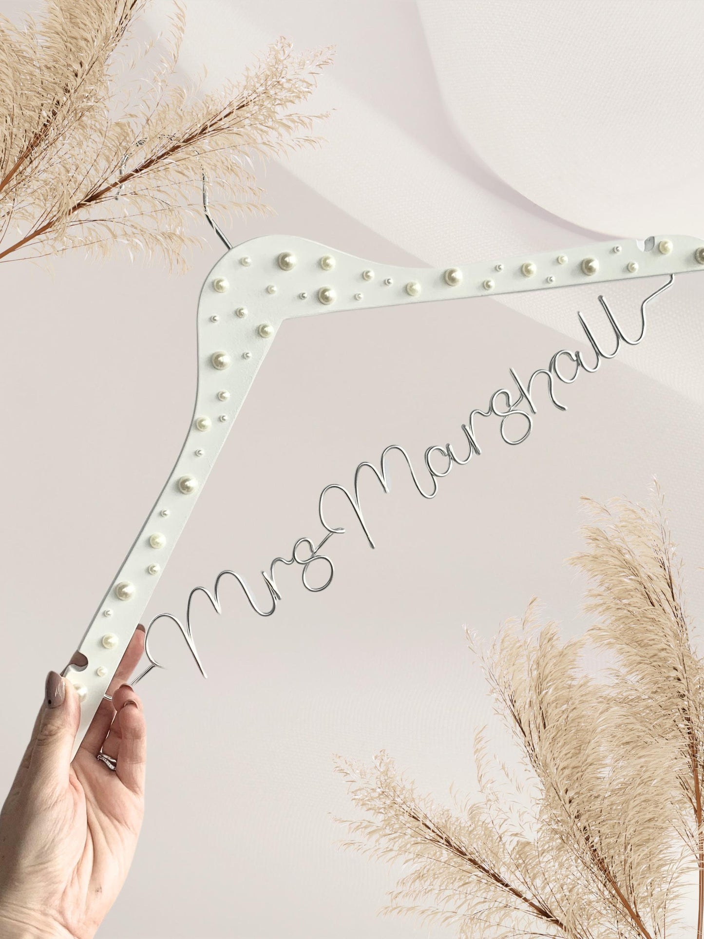 personalised wedding dress hanger, with silver wire name and pearl details