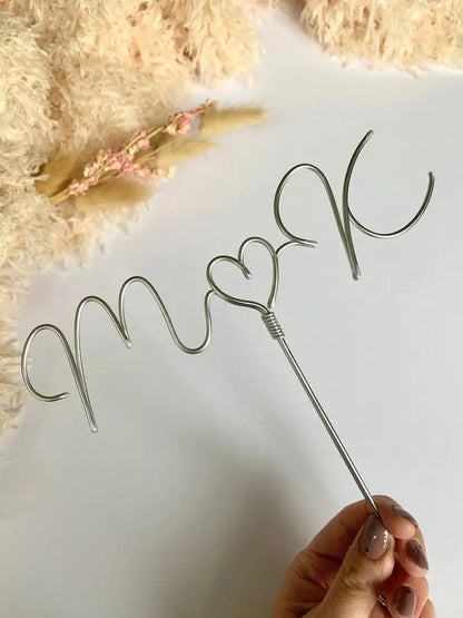 silver wedding cake topper, handmade wire with newlywed’s initials and heart