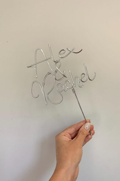 silver wire cake topper for wedding cake, with newlyweds names
