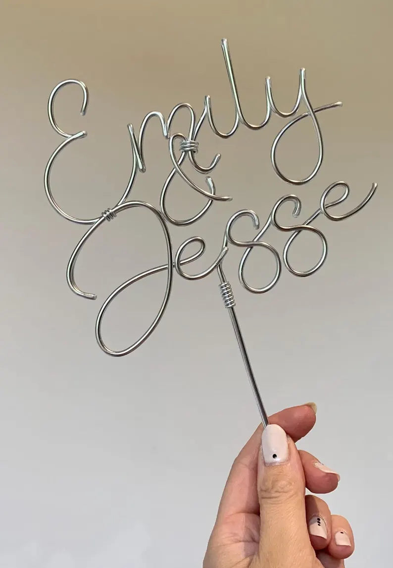handmade silver wire cake topper for wedding cake, with two names