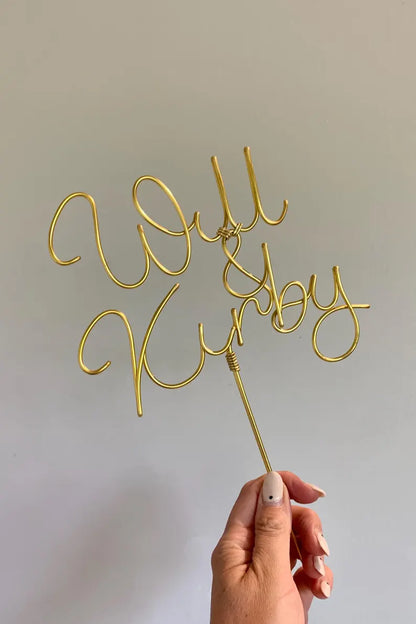 wedding cake topper in yellow gold wire, customised with mr and mrs names